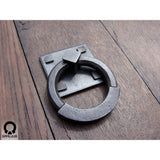 wrought iron ring pull with square backplate attached to a wooden door made by gaaluub