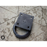 backside of a wrought iron ring pull with square backplate